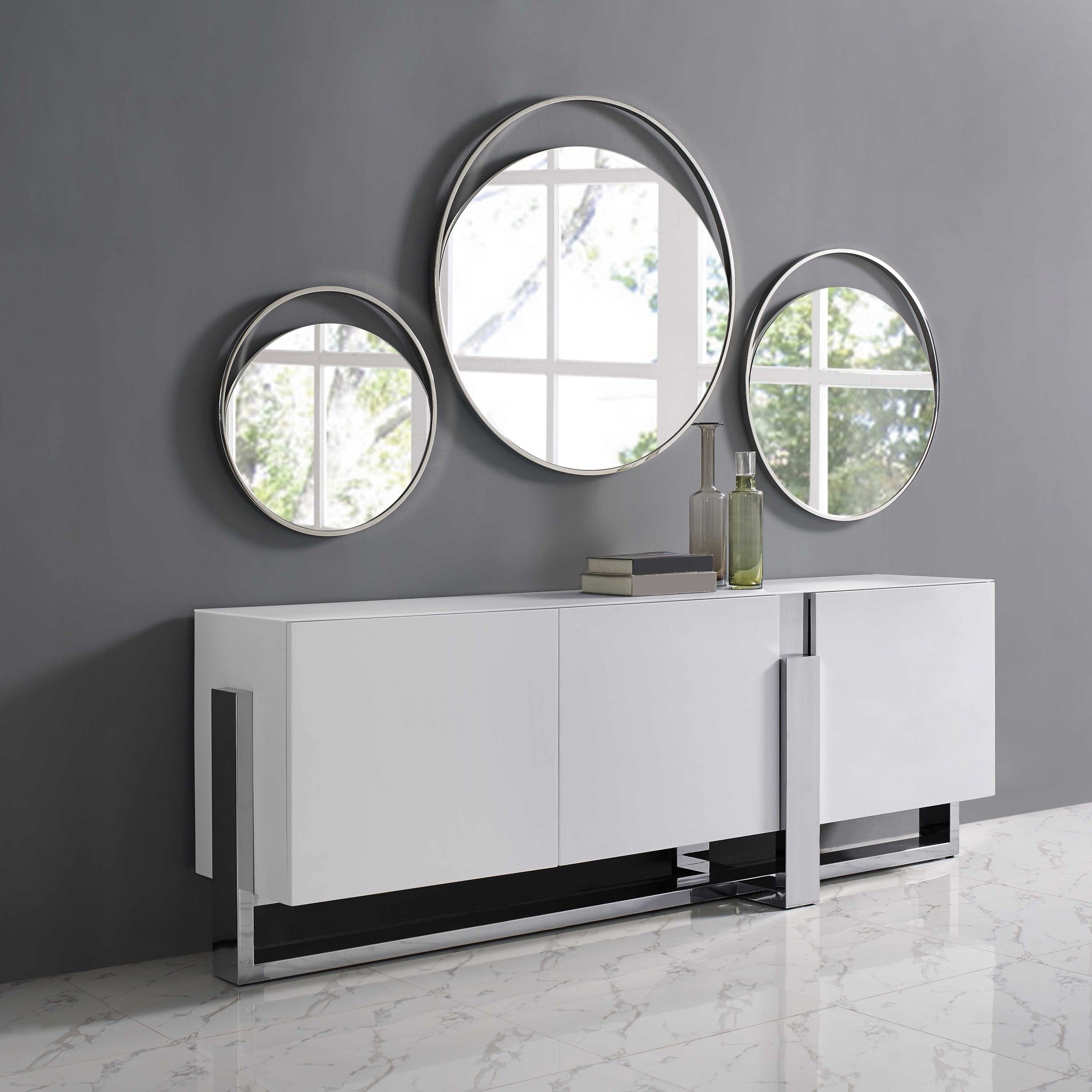 Medium Round Mirror In Matte White. Polished Stainless Steel Frame.