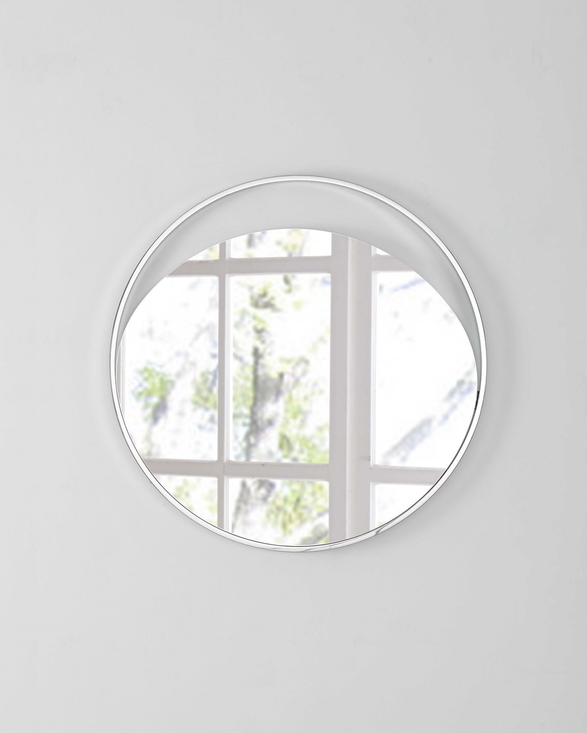 Medium Round Mirror In Matte White. Polished Stainless Steel Frame.