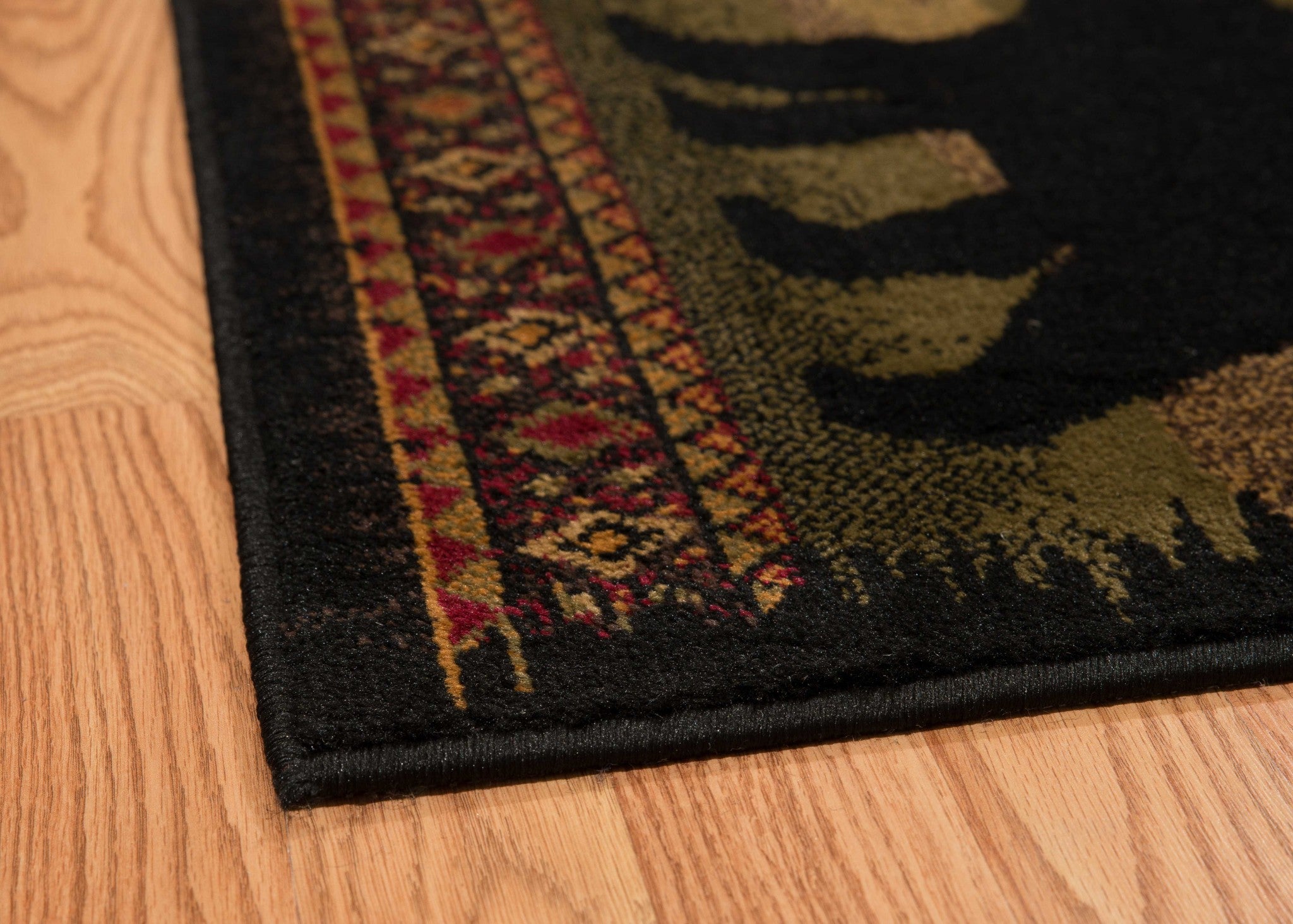 63" x 86" Black Polypropylene Bears Lodge Area Rug