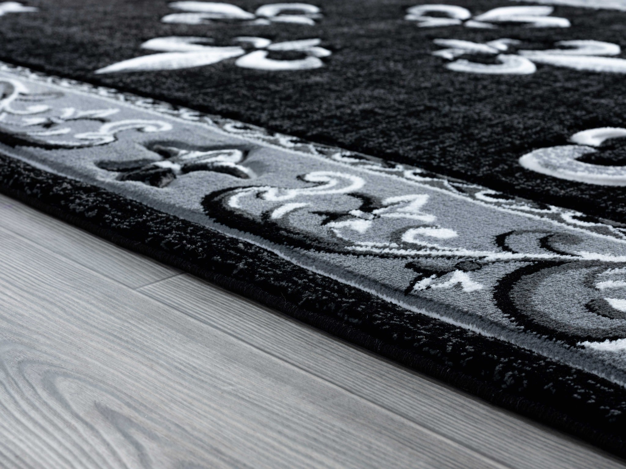 63" x 90" Black Olefin / Polypropylene Area Rug