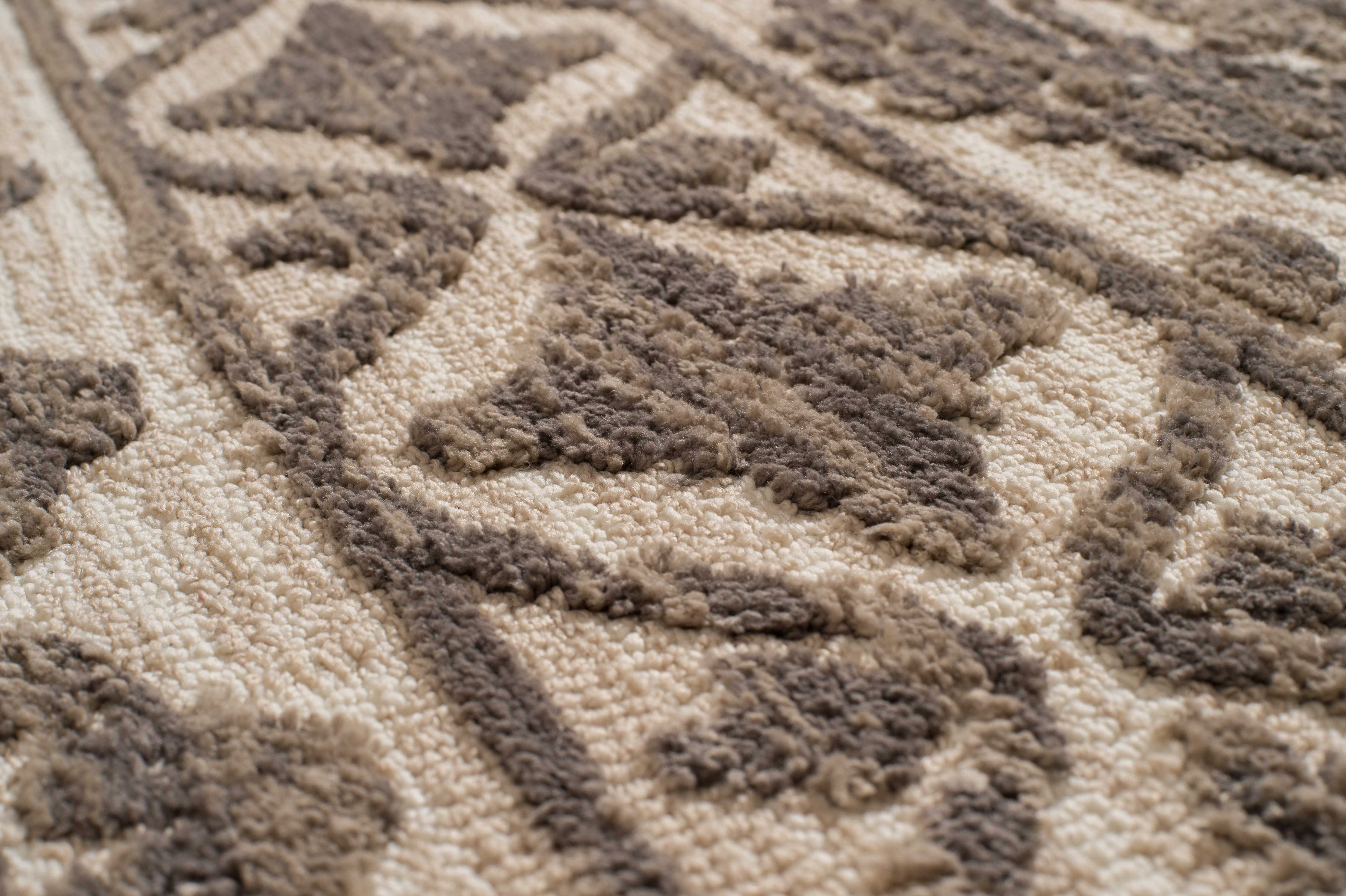 63" x 90" Cream Polyester Area Rug