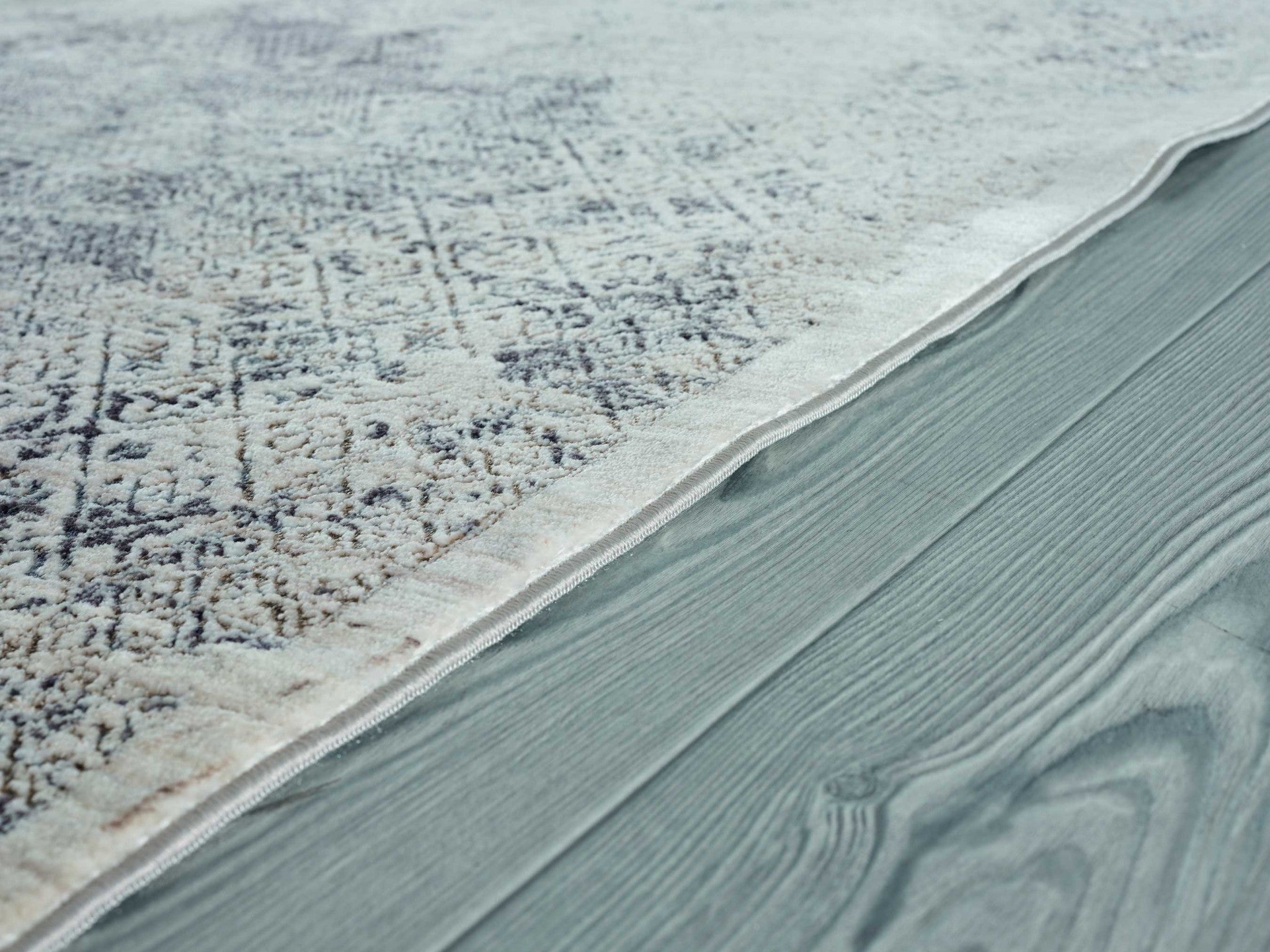 64" x 94" Bone Polyester Area Rug