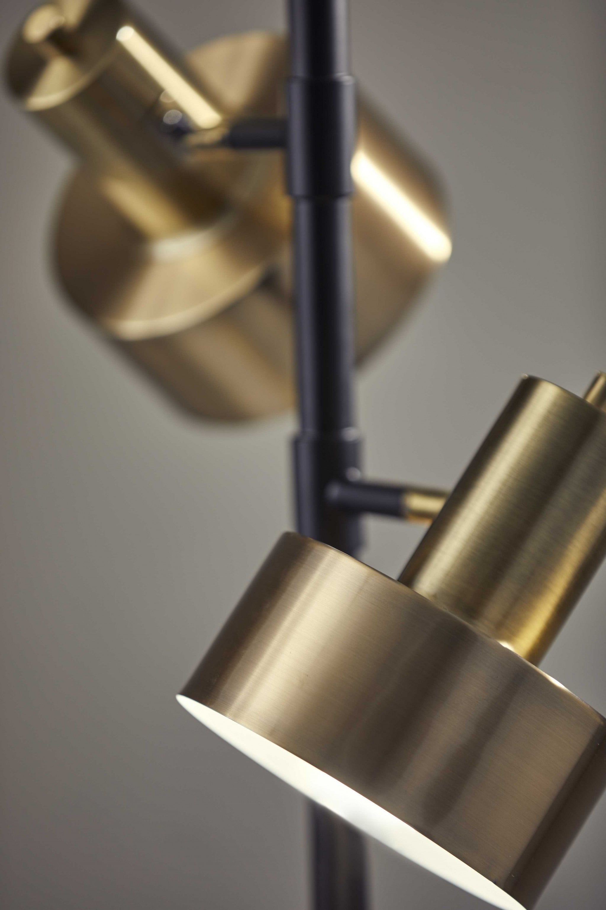 Three Light Floor Lamp with Matte Black Pole and Adjustable Antique Brass Metal Shades