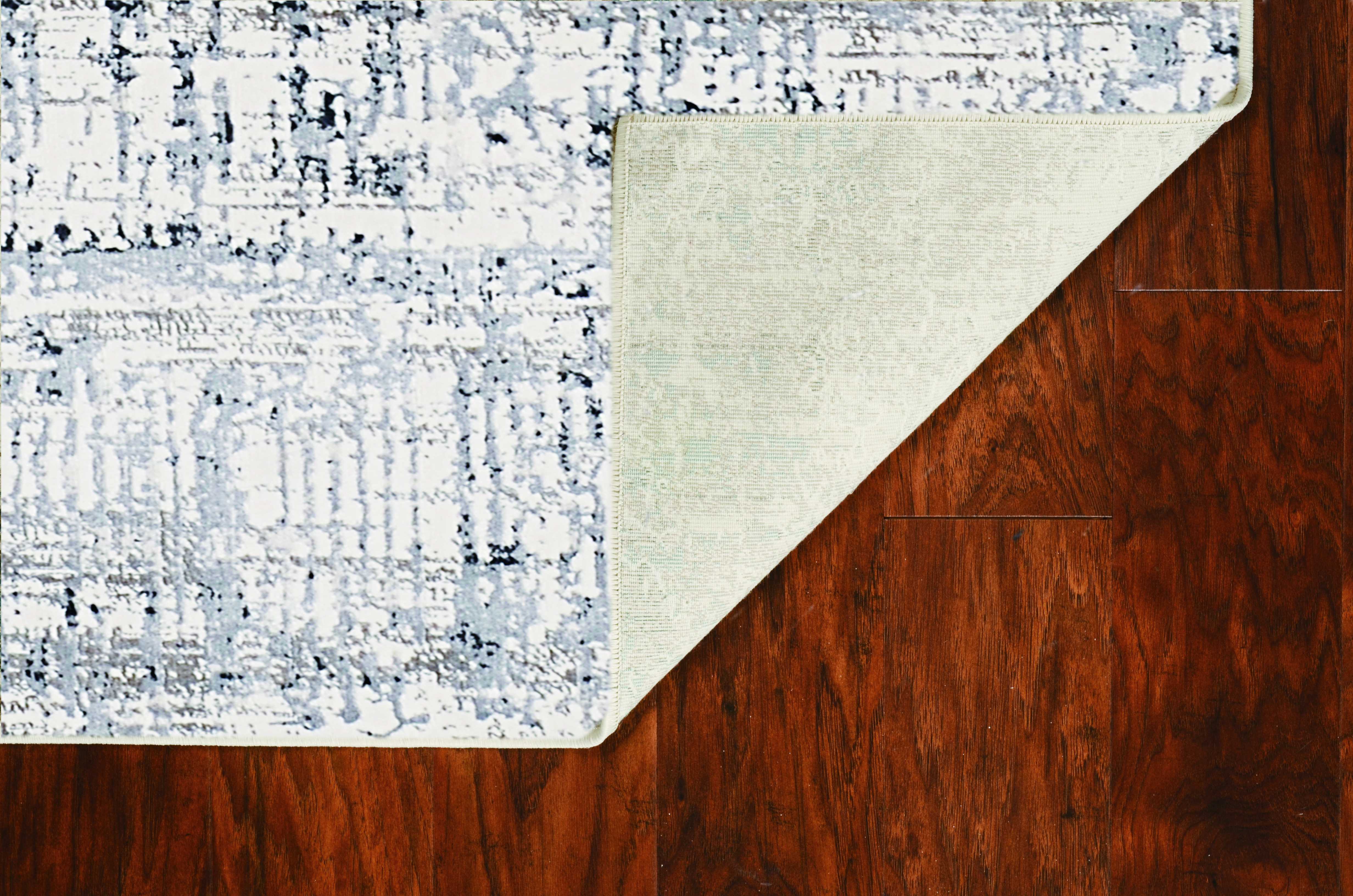 79" X 114" Ivory  Silver Polypropelene or Viscose Rug