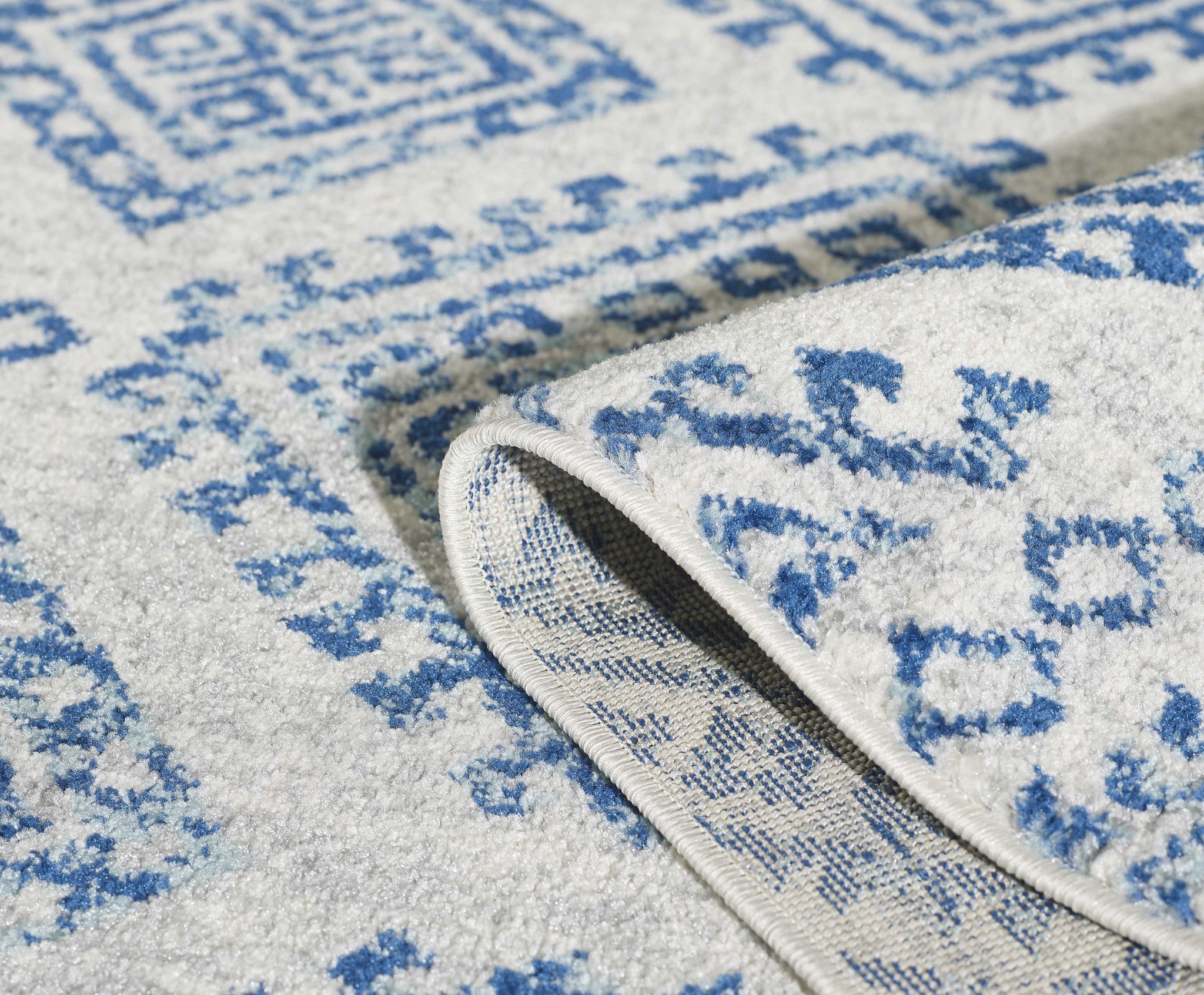 81" X 144" Ivory or Blue Polypropelene Rug