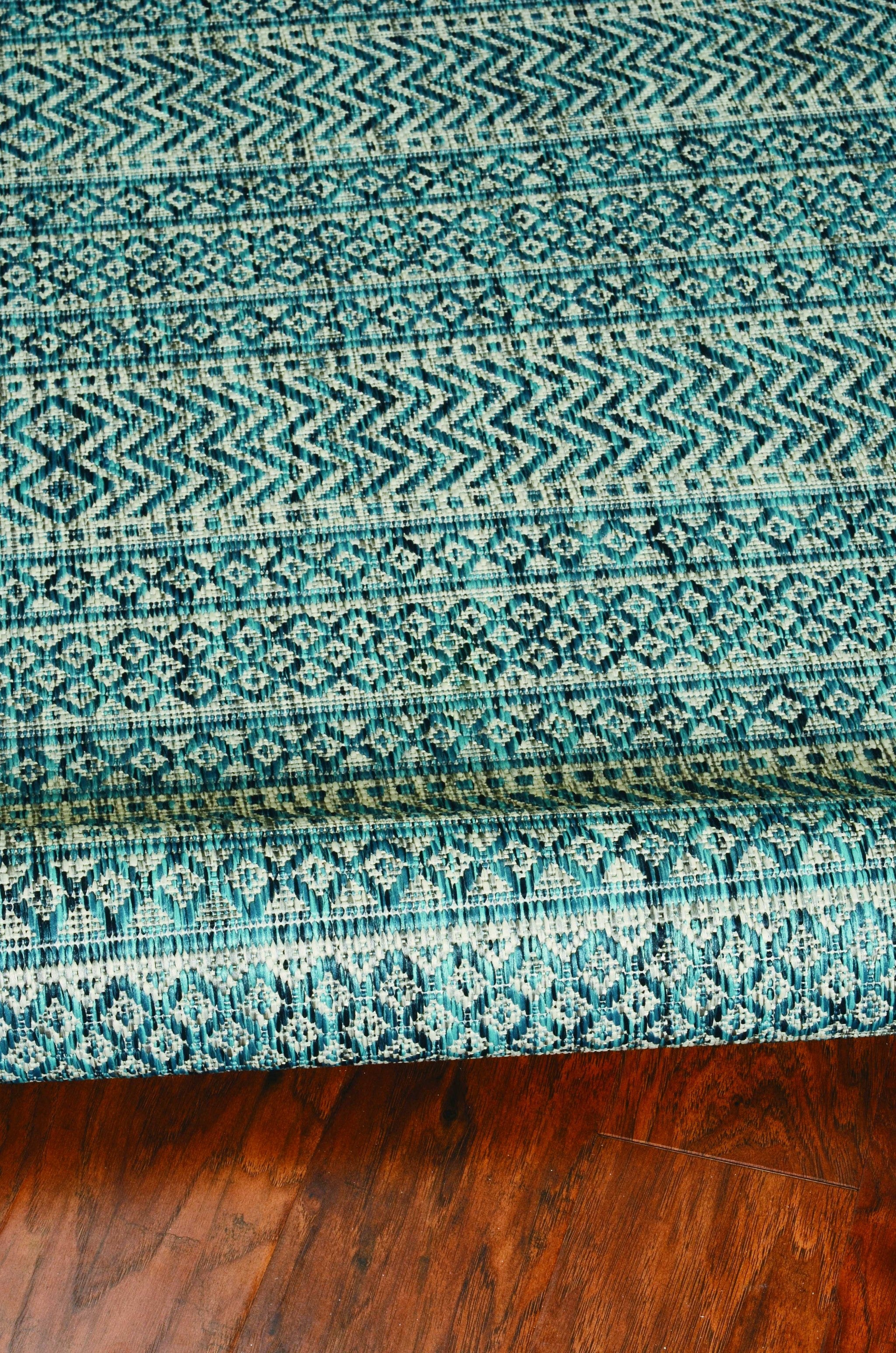 63" X 91" Teal Polypropylene Rug